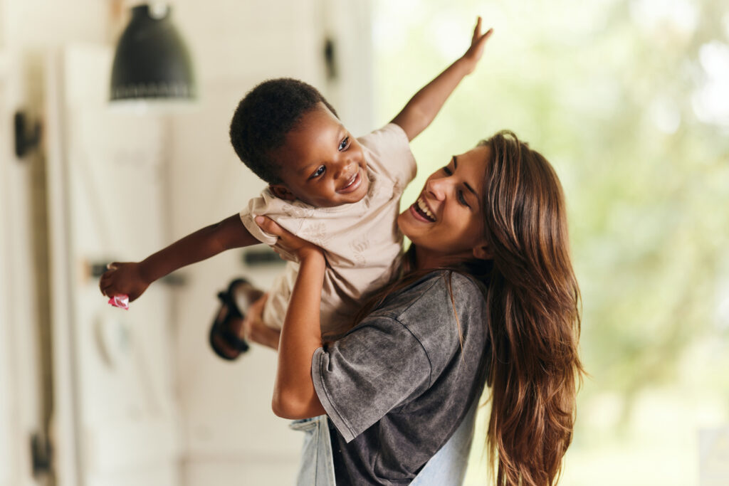 Mother and son at home playing